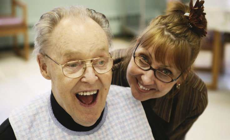 "With lots of experience you can earn more than £45,000" A manager in a nursing home enjoys sharing a joke with a service user