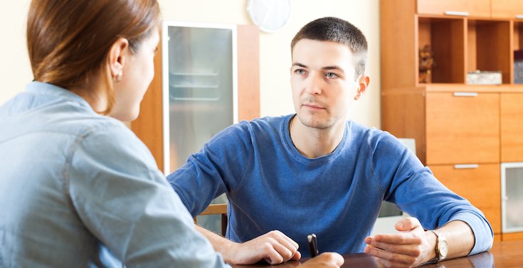 Mental health nurse jobs' frequently asked questions Two people talking at a desk